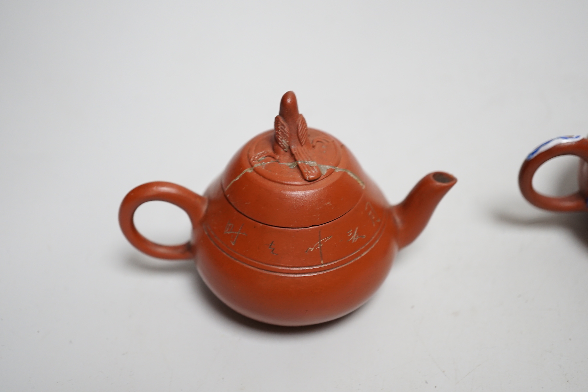 Five early 20th century Chinese Yixing teapots, widest 20cm